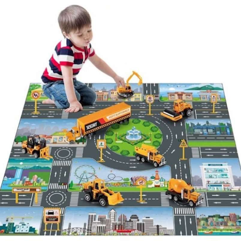 Child playing with Huitich educational construction vehicle toys set on city road play mat