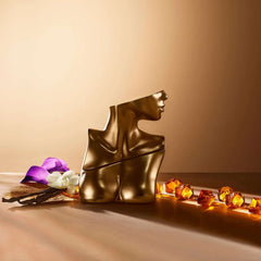 Eilish Eau de Parfum for women artistic gold bottle shaped like a human bust with flowers and amber stones