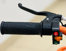 Black handlebar throttle switch with orange controls and brake lever