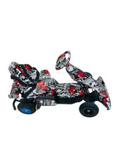 Kids electric go kart with safety harness, side view, black/white/red graffiti wrap