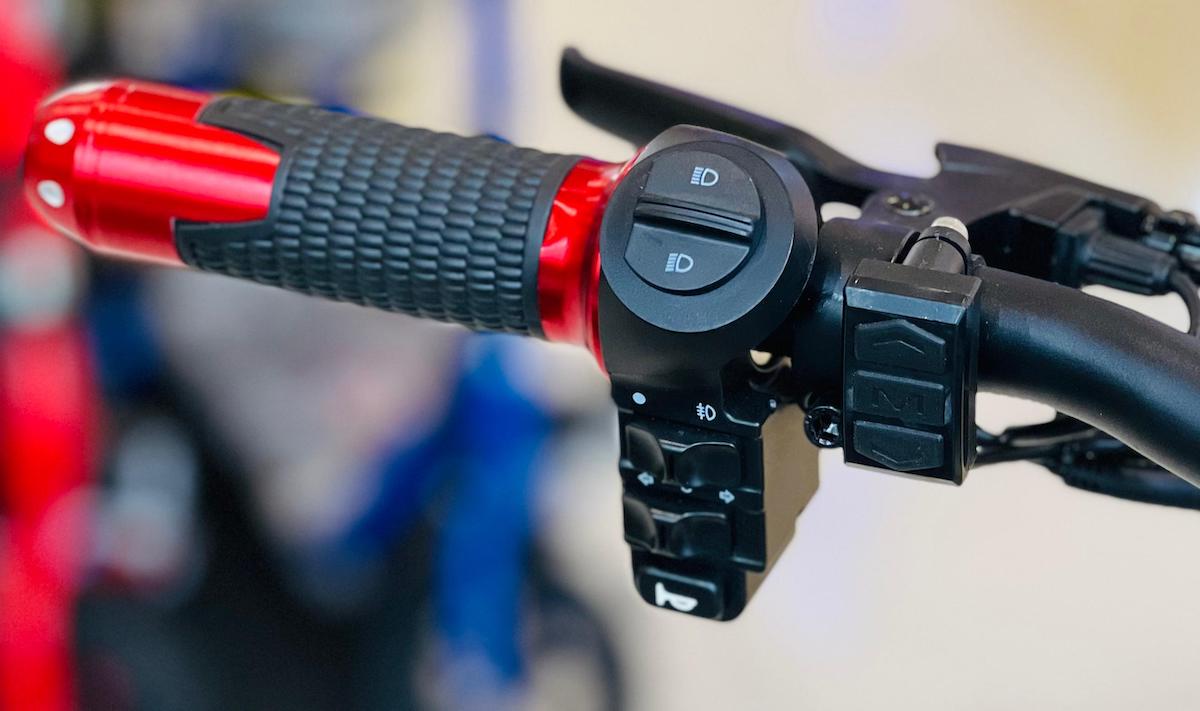 Close-up of Rohan Wings electric scooter 2000W UAE handlebar controls with throttle and display