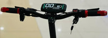 Electric scooter handlebar with digital screen, red grips, and black front stem.