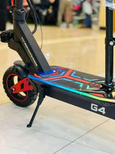 Electric scooter front wheel and stem with blue-green deck graphics