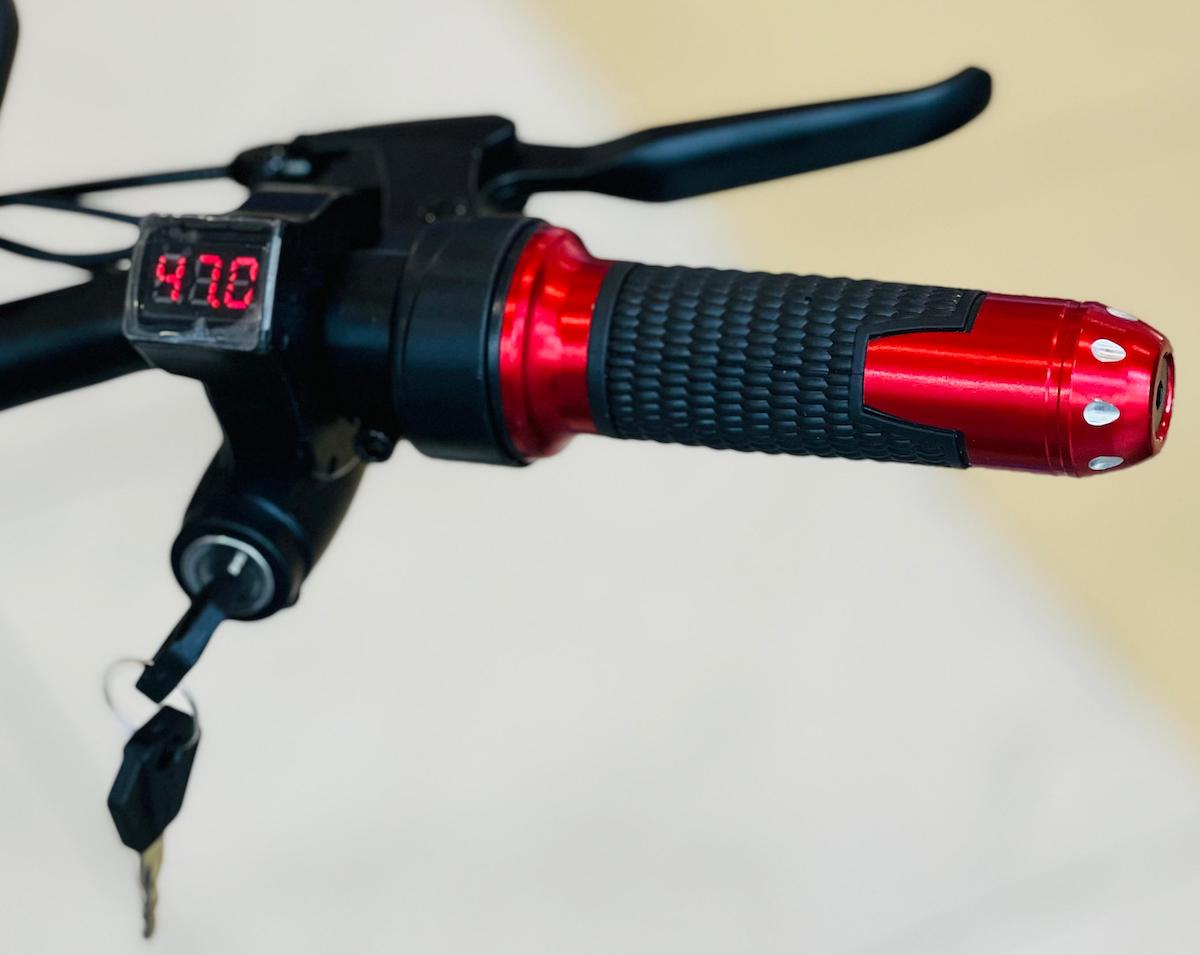Close-up of Rohan Wings electric scooter 2000W UAE handlebar with digital display and grip