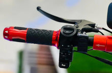 Electric scooter throttle and handlebar controls with red grip and circular mode button