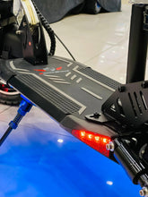 Electric scooter deck with textured footplate and red rear light