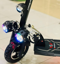 Electric scooter front wheel and handlebars with blue headlights and illuminated front light
