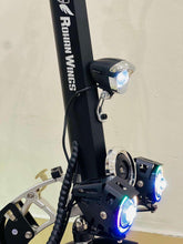 Electric scooter front section with headlight, suspension fork, and blue-lit wheels
