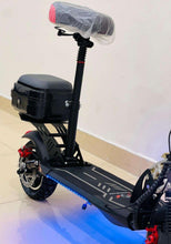 Black electric scooter side view with rear cargo box, padded seat, and blue underglow