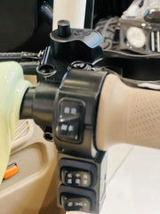 Close-up of controls on Rohan Wings electric tricycle UAE, showcasing handlebars and buttons for easy navigation