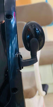 Steering control area of electric 3-wheel tricycle with black handle and beige frame