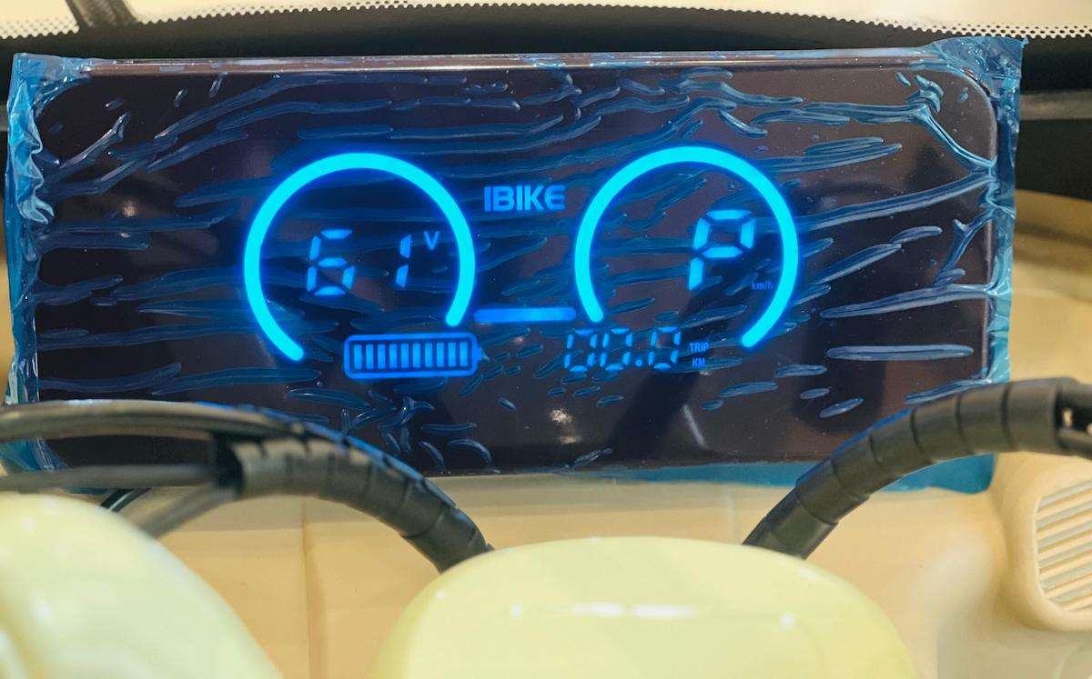 Dashboard display of a Rohan Wings electric tricycle UAE showing battery and speed indicators