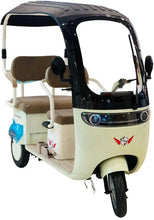 Front view of electric 3-wheel tricycle with black canopy, beige body and headlight