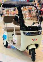 Electric tricycle front with canopy, headlight, and brown seat