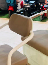 Electric tricycle front seat with brown backrest and armrests