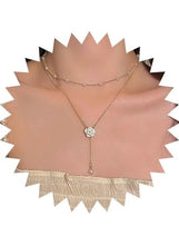 Y-shaped pearl necklace with flower pendant and long dangling drop charm
