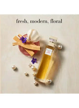 Elizabeth Arden 5th Avenue EDP spray bottle with gold liquid, gold cap, and label