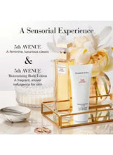 Elizabeth Arden 5th Avenue EDP and lotion bottles on display with gold accents