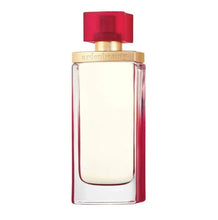 Clear glass perfume bottle with red cap and gold collar, front view