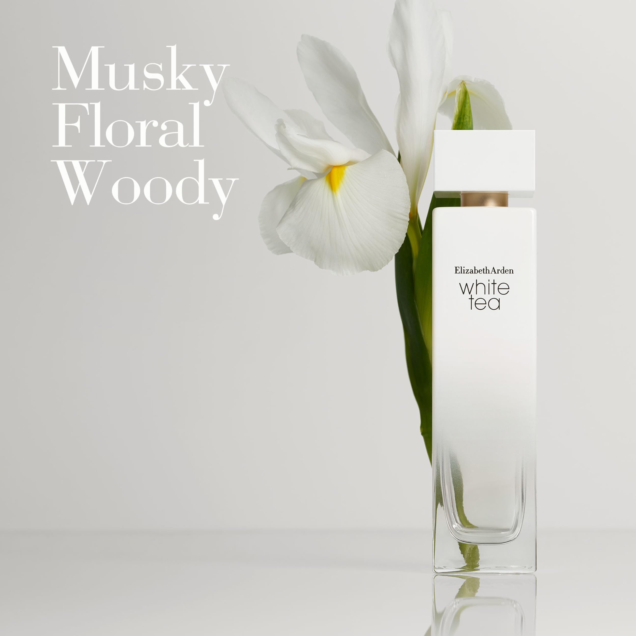 Elizabeth Arden White Tea perfume bottle with white flower and musky floral woody scent text