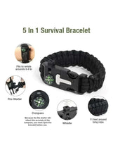 Black survival bracelet with built-in compass, whistle, and fire starter