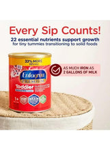 Enfagrow Premium toddler nutritional drink can, vanilla flavor, on textured surface