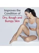 Woman applying Eucerin lotion to her leg on a bed or couch.