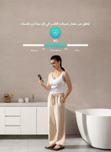 Smart digital body weight scale with person standing barefoot and health graph on phone