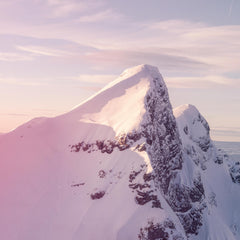 Evian facial spray 5 oz inspired by pure mountain spring water with snowy peak background