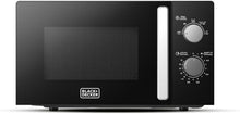 BLACK+DECKER black microwave oven with chrome handle and top control dials