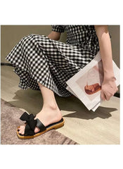 Huitich fairy style wedge sandals in black with bow detail worn with a checkered dress