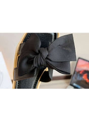 Huitich black fairy style wedge sandals with a large bow detail on the strap