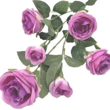Purple faux rose branch with five blooms and green leaf sprigs