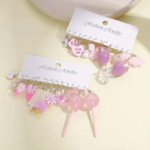 Pink dangle charm earrings set with heart, flower, and cute animal charms