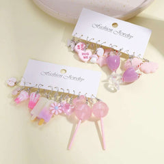 Huitich pink dangle charm earrings set featuring various cute pink and purple designs on white display cards
