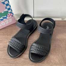 Huitich black woven sandals pair with open toe and ankle strap, textured braided upper