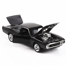 Black toy muscle car model with open hood showing engine and chrome front grille