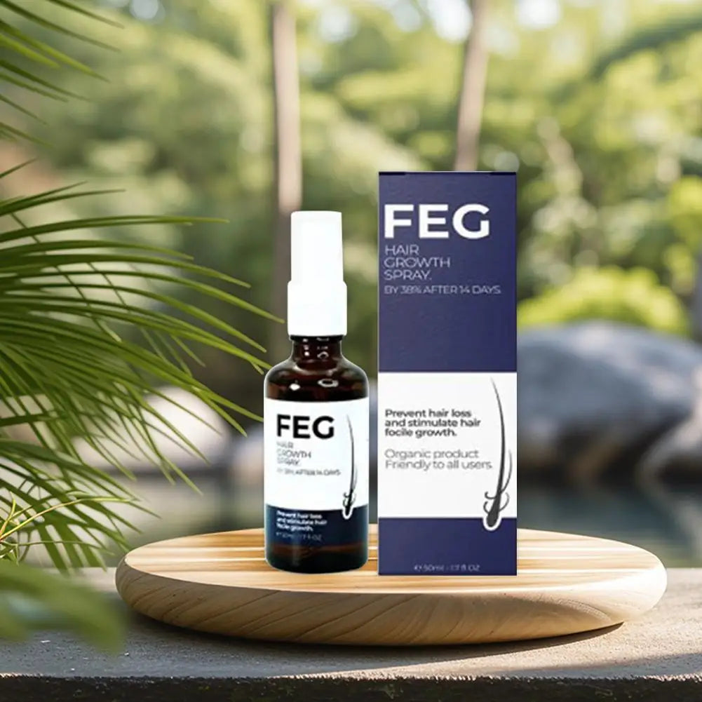FEG hair growth oil spray in a brown bottle on a wooden tray, with packaging and a natural background