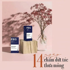 Mumzar FEG Hair Growth Spray for hair loss displayed with decorative flowers on a pink background