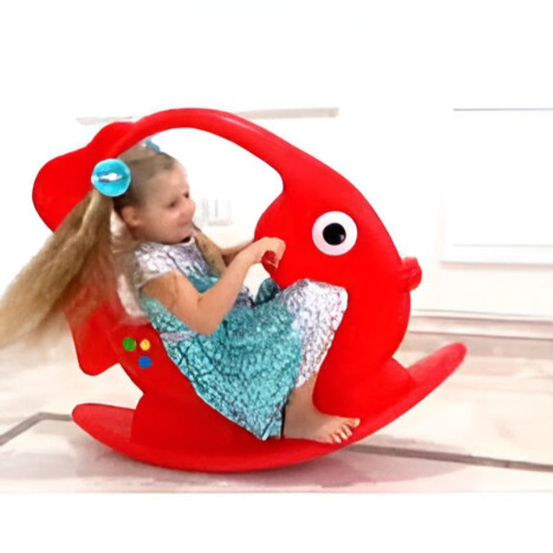 Huitich red fish shape rocking chair with a child playing indoors on a rocking and spring ride-on