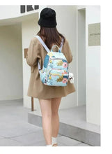 Kids travel backpack with blue straps and colorful animal, rainbow and cactus print