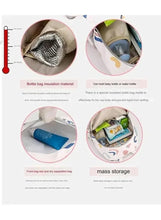 Blue insulated baby travel bag with foil-lined bottle pocket and mass storage section