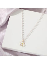 Pearl beaded necklace with daisy pendant, gold-tone charm on pearl bead strand