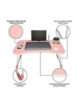 Pink laptop desk showing tabletop with side phone groove, cup hole, and folded metal legs