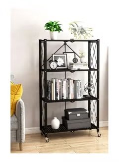 Huitich foldable metal garage shelving unit in black with four shelves holding books and decor