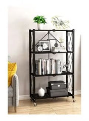Huitich foldable metal garage shelving unit in black with four shelves holding books and decor