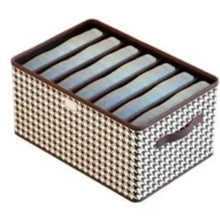 Foldable storage box with hinged lid, houndstooth fabric and striped top insert