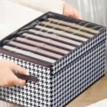 Foldable storage box with open lid, houndstooth fabric and side drawer pull slot