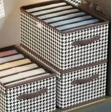 Foldable storage box with lid closed, houndstooth fabric and front pull handle