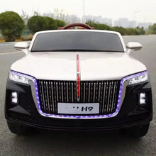 Kids electric ride-on car: white hood, black front, glowing blue LED headlights and grille